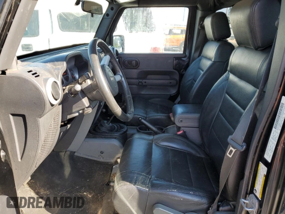 2008 Jeep Wrangler Unlimited Sahara with VIN 1J4GB59138L506461, listed as a Copart auction lot 75082664 with 178,944 mi miles and Salvage title. Bid and sale history available at DreamBid. Image 7.