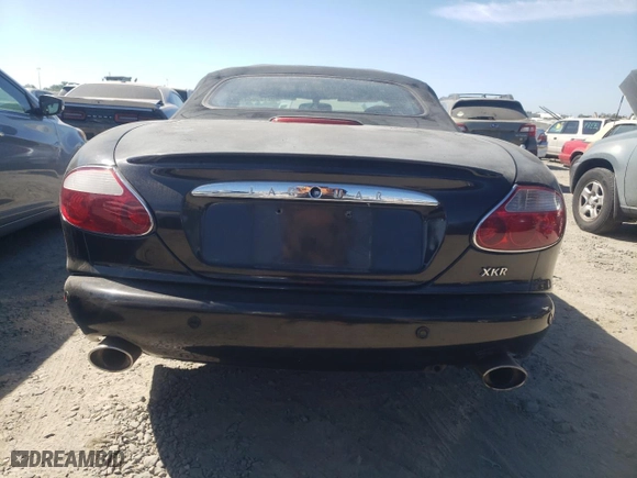 2001 Jaguar XK8 with VIN SAJDA42B51PA15157, listed as a Copart auction lot 67139634 with 110,506 mi miles and Salvage Title. Bid and sale history available at carsss.com. Image 6.