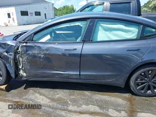 2023 Tesla Model 3 z VIN 5YJ3E1EA7PF413311, wystawiony jako IAAI lot #42442055 z przebiegiem 25 270 mil mil oraz . Historia ofert i sprzedaży dostępna na DreamBid. Obrazek 14.