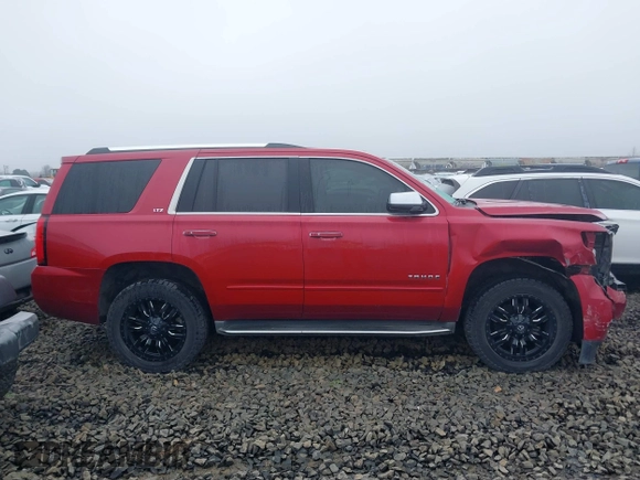 2015 Chevrolet Tahoe LTZ z VIN 1GNSKCKC6FR276531, wystawiony jako IAAI lot #41692617 z przebiegiem 124 010 mil mil oraz . Historia ofert i sprzedaży dostępna na DreamBid. Obrazek 13.