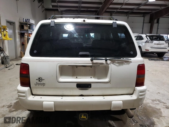 1998 Jeep Grand Cherokee Laredo with VIN 1J4GZ48SXWC183782, listed as a Copart auction lot 41700675 with 226,544 mi miles and Salvage Title. Bid and sale history available at carsss.com. Image 6.