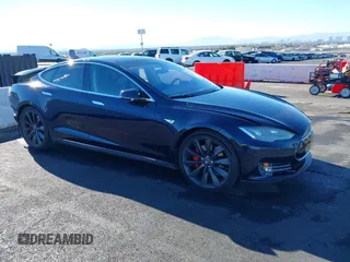 2014 Tesla Model S 60 with VIN 5YJSA1H14EFP57209, listed as a IAAI auction lot 41305157 with 141,364 mi miles and . Bid and sale history available at DreamBid. Image 1.