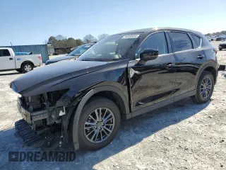 2021 Mazda CX-5 Touring with VIN JM3KFACM2M0443131, listed as a Copart auction lot 48559035 with 31,733 mi miles and Salvage Title. Bid and sale history available at carsss.com. Image 1.