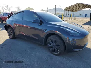 2024 Tesla Model Y with VIN 7SAYGDED7RF108604, listed as a Copart auction lot 48384825 with 24,603 mi miles and Salvage Title. Bid and sale history available at DreamBid. Image 4.