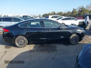 2017 Ford Fusion Energi SE with VIN 3FA6P0PU0HR129792, listed as a IAAI auction lot 41104376 with 86,659 mi miles. Bid and sale history available at carsss.com. Image 13.