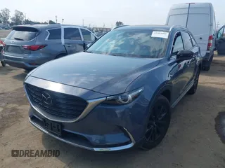 2021 Mazda CX-9 Carbon Edition z VIN JM3TCBDY0M0526352, wystawiony jako IAAI lot #42403901 z przebiegiem 50 193 mil mil oraz . Historia ofert i sprzedaży dostępna na DreamBid. Obrazek 2.