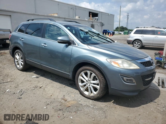 2012 Mazda CX-9 Grand Touring with VIN JM3TB2DVXC0361644, listed as a Copart auction lot 66092895 with 121,021 mi miles and Clean title. Bid and sale history available at DreamBid. Image 4.