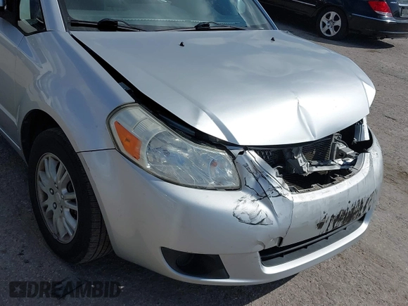 2012 Suzuki SX4 LE with VIN JS2YC5A30C6304324, listed as a IAAI auction lot 41585174 with 111,471 mi miles. Bid and sale history available at carsss.com. Image 13.