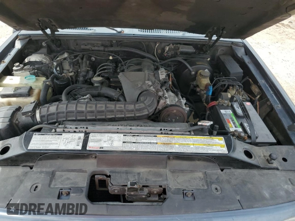 1999 Ford Explorer Sport z VIN 1FMYU22X9XUC03819, wystawiony jako Copart lot #69840564 z przebiegiem 214 315 mil mil oraz Szkoda całkowita • Salvage title. Historia ofert i sprzedaży dostępna na DreamBid. Obrazek 12.