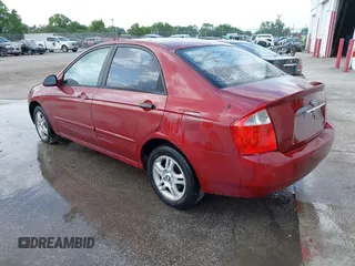 2004 Kia Spectra LX with VIN KNAFE121545021648, listed as a IAAI auction lot 41842471 with 211,436 mi miles. Bid and sale history available at carsss.com. Image 3.