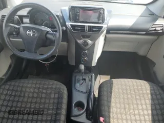 2014 Scion iQ with VIN JTNJJXB07EJ028558, listed as a Copart auction lot 64745345 with 112,221 mi miles and Clean title. Bid and sale history available at DreamBid. Image 8.