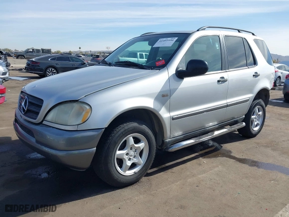 1999 Mercedes-Benz M-Class with VIN 4JGAB54E3XA114558, listed as a IAAI auction lot 41402590 with 182,740 mi miles. Bid and sale history available at carsss.com. Image 17.