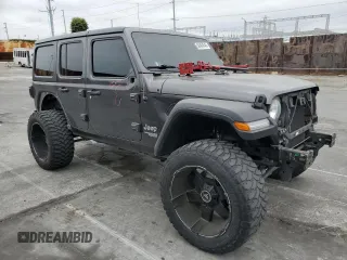 2019 Jeep Wrangler Unlimited Sport S with VIN 1C4HJXDG5KW535115, listed as a Copart auction lot 58404545 with 95,491 mi miles and Salvage title. Bid and sale history available at DreamBid. Image 4.
