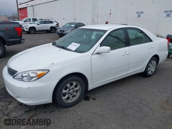2002 Toyota Camry LE z VIN 4T1BE32K52U081479, wystawiony jako IAAI lot #41344104 z przebiegiem 243 950 mil mil oraz . Historia ofert i sprzedaży dostępna na DreamBid. Obrazek 17.