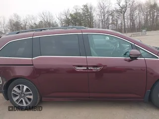 2014 Honda Odyssey Touring with VIN 5FNRL5H97EB117971, listed as a IAAI auction lot 41794324 with 198,191 mi miles and . Bid and sale history available at DreamBid. Image 13.