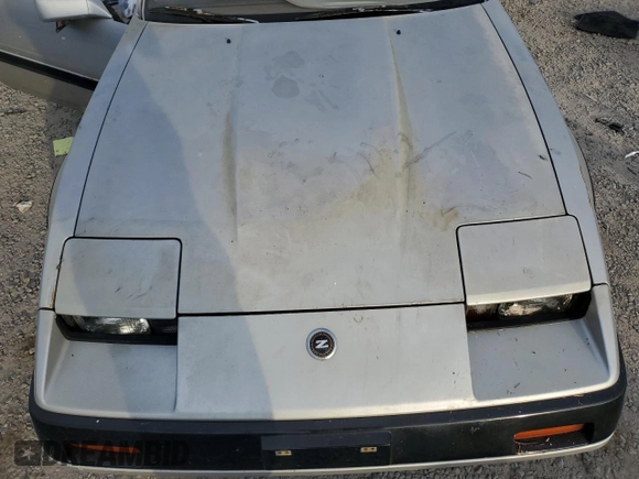 1984 Nissan 300ZX z VIN JN1HZ16S5EX016042, wystawiony jako Copart lot #86071904 z przebiegiem Nie podano mil oraz Szkoda całkowita • Salvage title. Historia ofert i sprzedaży dostępna na DreamBid. Obrazek 11.