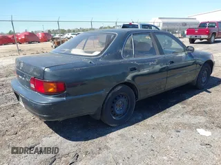 1995 Toyota Camry LE with VIN 4T1GK12E5SU860216, listed as a IAAI auction lot 41803933 with 235,130 mi miles. Bid and sale history available at carsss.com. Image 4.