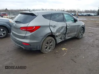 2016 Hyundai Santa Fe z VIN 5XYZTDLB1GG343763, wystawiony jako IAAI lot #41659641 z przebiegiem 96 415 mil mil oraz . Historia ofert i sprzedaży dostępna na DreamBid. Obrazek 4.
