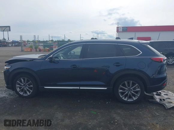 2020 Mazda CX-9 Grand Touring with VIN JM3TCBDY1L0402718, listed as a IAAI auction lot 42355511 with 87,205 mi miles and . Bid and sale history available at DreamBid. Image 14.