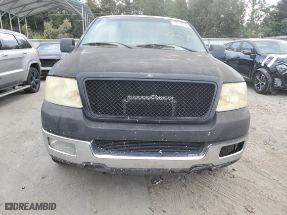 2004 Ford F-150 XL with VIN 1FTPX12584NA45852, listed as a Copart auction lot 77748944 with 0 mi miles and Salvage Title. Bid and sale history available at carsss.com. Image 5.