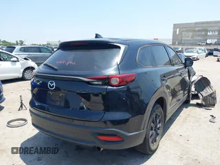 2021 Mazda CX-9 Touring with VIN JM3TCBCY8M0514905, listed as a IAAI auction lot 42385627 with 72,610 mi miles and . Bid and sale history available at DreamBid. Image 4.