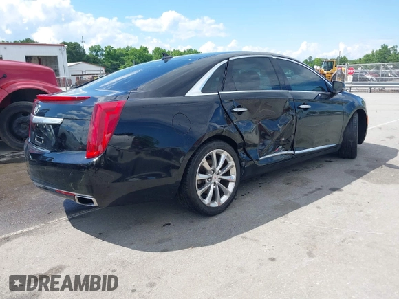 2014 Cadillac XTS Luxury z VIN 2G61N5S30E9170305, wystawiony jako IAAI lot #42223317 z przebiegiem 103 692 mil mil oraz . Historia ofert i sprzedaży dostępna na DreamBid. Obrazek 4.