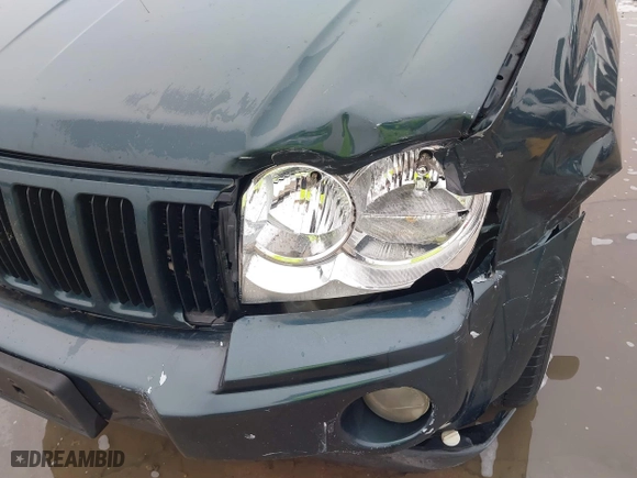 2005 Jeep Grand Cherokee Laredo with VIN 1J4GS48K45C677011, listed as a IAAI auction lot 41121018 with 210,814 mi miles. Bid and sale history available at carsss.com. Image 20.