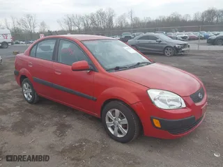 2009 Kia Rio SX with VIN KNADE223996556806, listed as a IAAI auction lot 42117938 with 54,007 mi miles. Bid and sale history available at carsss.com. Image 1.