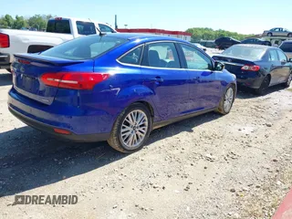 2015 Ford Focus Titanium with VIN 1FADP3J20FL304828, listed as a IAAI auction lot 42144101 with 199,715 mi miles and . Bid and sale history available at carsss.com. Image 4.
