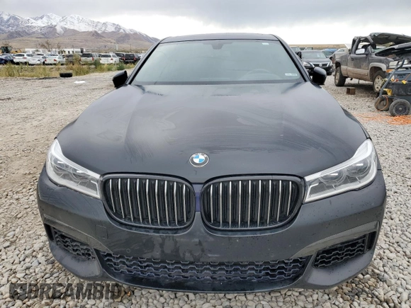 2018 BMW 7 Series 750i with VIN WBA7F0C55JGM23537, listed as a Copart auction lot 76824074 with 64,682 mi miles and Salvage Title. Bid and sale history available at carsss.com. Image 5.