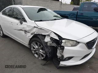 2016 Mazda Mazda6 i Touring with VIN JM1GJ1V52G1468807, listed as a IAAI auction lot 41888686 with 121,764 mi miles. Bid and sale history available at carsss.com. Image 6.