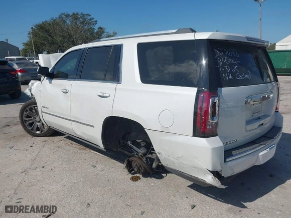 2016 GMC Yukon Denali with VIN 1GKS1CKJ9GR294828, listed as a IAAI auction lot 41497770 with 128,814 mi miles. Bid and sale history available at carsss.com. Image 3.