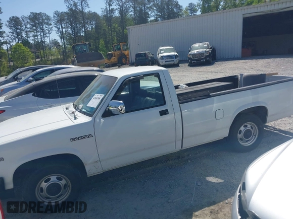 1991 Dodge Dakota S z VIN 1B7GL26XXMS302752, wystawiony jako IAAI lot #42060308 z przebiegiem 158 000 mil mil oraz . Historia ofert i sprzedaży dostępna na DreamBid. Obrazek 14.