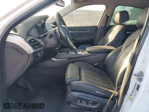 2016 BMW X6 sDrive35i with VIN 5UXKU0C56G0F92990, listed as a Copart auction lot 77191074 with 194,077 mi miles and Salvage Title. Bid and sale history available at carsss.com. Image 7.