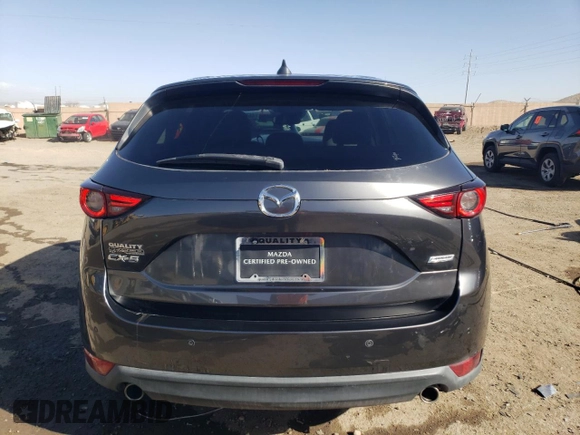 2018 Mazda CX-5 Grand Touring with VIN JM3KFADMXJ1323646, listed as a Copart auction lot 46857825 with 62,262 mi miles and Salvage title. Bid and sale history available at DreamBid. Image 6.