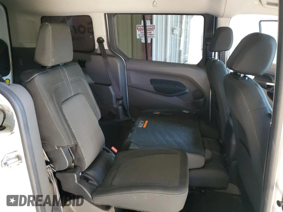 2020 Ford Transit Connect XLT z VIN NM0GS9F27L1465814, wystawiony jako Copart lot #77323984 z przebiegiem 111 727 mil mil oraz Czysty tytuł • Clean title. Historia ofert i sprzedaży dostępna na DreamBid. Obrazek 11.