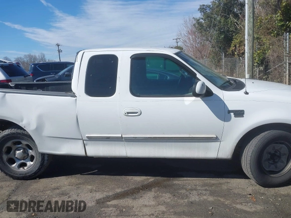 2002 Ford F-150 XL with VIN 1FTRX17L32NA13159, listed as a IAAI auction lot 41653814 with 435,395 mi miles. Bid and sale history available at carsss.com. Image 13.