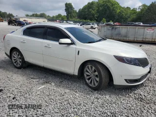 2013 Lincoln MKS with VIN 1LNHL9EK8DG605675, listed as a Copart auction lot 62448455 with 102,642 mi miles and Salvage title. Bid and sale history available at DreamBid. Image 4.
