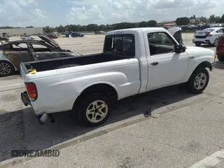 1999 Mazda B-Series 2WD Truck SX with VIN 4F4YR12C2XTM44471, listed as a IAAI auction lot 39659921 with 274,006 mi miles. Bid and sale history available at carsss.com. Image 4.