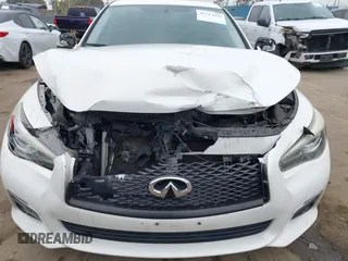 2015 Infiniti Q50 Premium z VIN JN1BV7AP2FM344044, wystawiony jako IAAI lot #42217012 z przebiegiem 155 714 mil mil oraz . Historia ofert i sprzedaży dostępna na DreamBid. Obrazek 6.