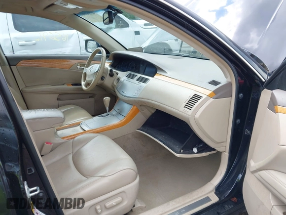 2007 Toyota Avalon XL z VIN 4T1BK36B87U184714, wystawiony jako IAAI lot #42243997 z przebiegiem 165 691 mil mil oraz . Historia ofert i sprzedaży dostępna na DreamBid. Obrazek 5.