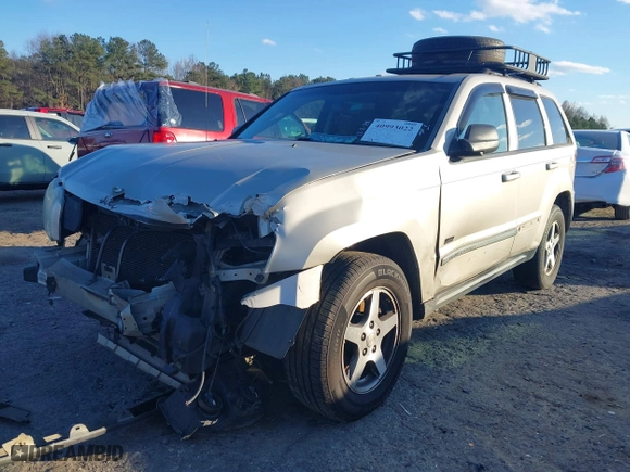 2007 Jeep Grand Cherokee Laredo with VIN 1J8GS48K07C630303, listed as a IAAI auction lot 40993022 with 254,294 mi miles. Bid and sale history available at carsss.com. Image 2.