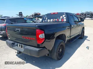 2019 Toyota Tundra SR with VIN 5TFUY5F13KX852912, listed as a IAAI auction lot 42327399 with 124,193 mi miles and . Bid and sale history available at DreamBid. Image 4.