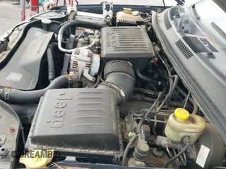 2002 Jeep Grand Cherokee Limited with VIN 1J4GW58N62C325273, listed as a IAAI auction lot 43278609 with 199,299 mi miles and . Bid and sale history available at DreamBid. Image 17.