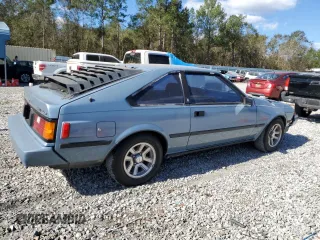 1983 Toyota Celica z VIN JT2RA64L7D6174381, wystawiony jako Copart lot #75986554 z przebiegiem 312 583 mil mil oraz Szkoda całkowita • Salvage title. Historia ofert i sprzedaży dostępna na DreamBid. Obrazek 3.