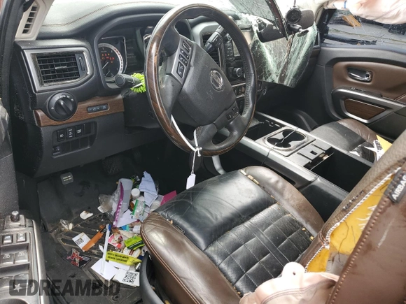 2016 Nissan Titan Platinum Reserve z VIN 1N6BA1F28GN506397, wystawiony jako Copart lot #53831235 z przebiegiem 258 474 mil mil oraz Nie do naprawy • Non repairable. Historia ofert i sprzedaży dostępna na DreamBid. Obrazek 8.