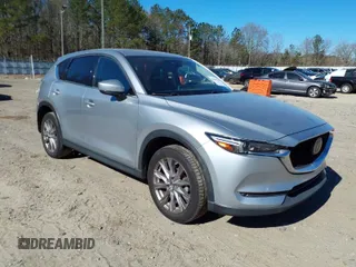 2020 Mazda CX-5 Grand Touring with VIN JM3KFADM7L0731479, listed as a IAAI auction lot 41697226 with 90,517 mi miles. Bid and sale history available at carsss.com. Image 1.