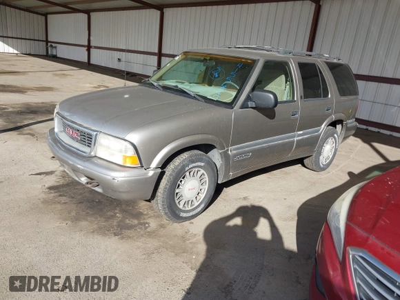 1999 GMC Jimmy SLE with VIN 1GKDT13W7X2529298, listed as a IAAI auction lot 41556249 with 114,750 mi miles. Bid and sale history available at carsss.com. Image 2.