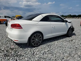 2013 Volkswagen Eos Sport с VIN WVWBW8AH8DV001948, выставлен на аукционе Copart как лот 56292615 с пробегом 75 398 миль миль и На запчасти • Non repairable. История ставок и продаж доступна на DreamBid. Изображение 3.