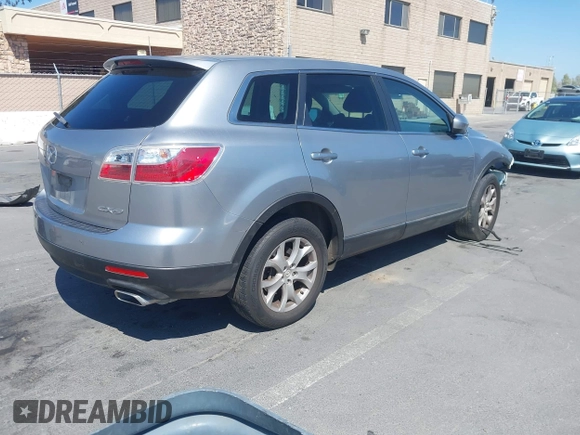 2011 Mazda CX-9 Sport with VIN JM3TB2BVXB0307360, listed as a IAAI auction lot 42580629 with 136,928 mi miles and . Bid and sale history available at DreamBid. Image 4.